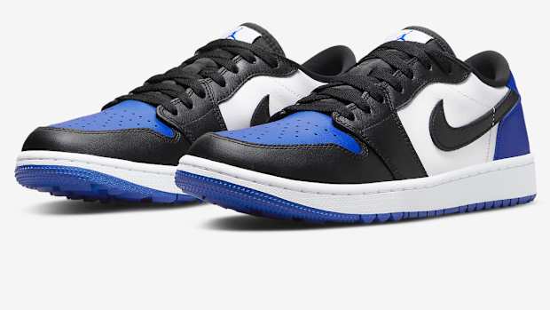 Black, blue, and white Jordan golf shoes.